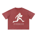 Runningman boxy tee in Brick, front, AW Fitness Club runner lockup with the Become the Gym tagline