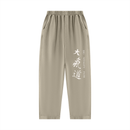 Runningman mineral wash sweatpants in Khaki, front, Dai Ki Do kanji with the Big Vitality Path translation down the right leg