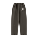 Runningman mineral wash sweatpants in Coffee, back, runner mark on the pocket and the I am the weight line up the left leg