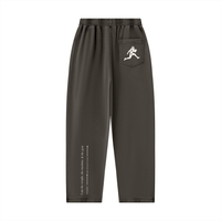 Runningman mineral wash sweatpants in Coffee, back, runner mark on the pocket and the I am the weight line up the left leg