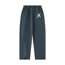 Runningman mineral wash sweatpants in Navy, back, runner mark on the pocket and the I am the weight line up the left leg