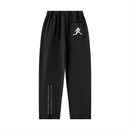 Runningman mineral wash sweatpants in Black, back, runner mark on the pocket and the I am the weight line up the left leg