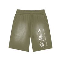 Runningman washed training shorts in Olive, front, Dai Ki Do kanji with the Big Vitality Path translation printed down the right leg